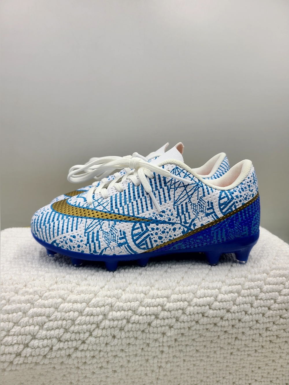 Kids White & Blue Soccer Cleats with Gold Swoosh